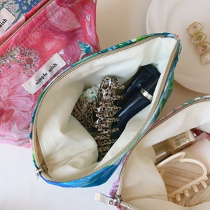 Floral Liberty print makeup bags with simple wish label and smooth zipper detail