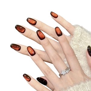 Handmade deep red shimmering cat eye press-on nails with elegant star ring jewelry