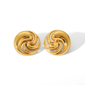 Detailed macro view of spiral golden texture on 18K gold plated stainless steel stud earrings