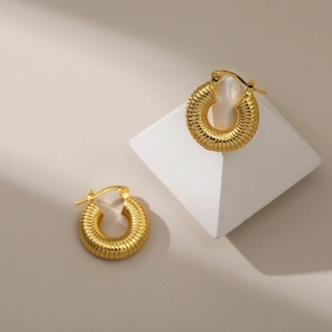 18K gold plated copper hoop earrings with textured spiral design on geometric bases