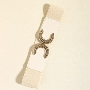 Detail of elastic waist belt with textured gold buckle and premium cream leather accents