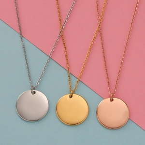 Detailed comparison of round stainless steel pendants in gold, silver, and rose gold finishes