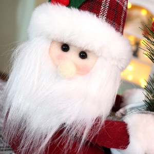 Close-up of Santa Claus plush with red plaid hat, white beard and detailed felt texture