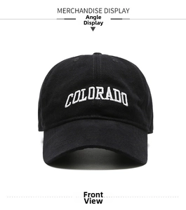 Detailed close-up of a black cotton baseball cap featuring white 3D Colorado embroidery