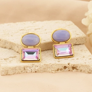 Macro detail of double-layered purple gemstone earrings with gold-plated titanium steel edges