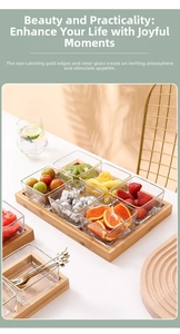 Detail view of square glass bowls with gold rims on a natural wooden serving tray