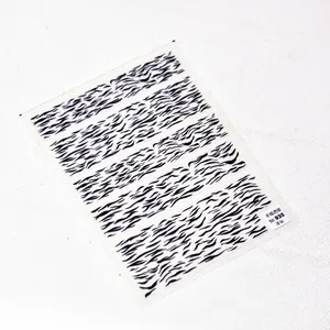 Detail of TO-935 thin and tough hand-drawn tiger pattern nail art stickers on white sheet