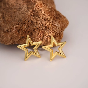 Luxury gold hollow star stud earrings in stainless steel with a minimalist geometric design
