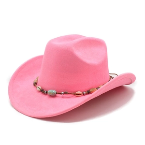 Detailed view of pink suede cowboy hat with bohemian shell and ethnic beaded band