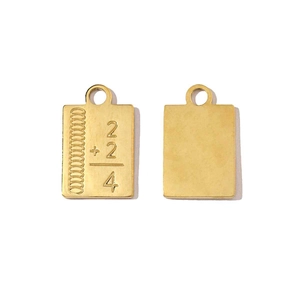 Detailed view of golden square pendant featuring a 2+2=4 mathematical engraving