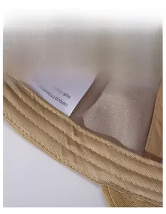 Detail view of khaki cotton baseball cap featuring a wide 100% cotton sweatband for comfort