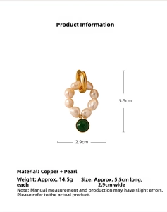 Detailed view of handmade baroque pearl earrings with green stone drop and size measurements