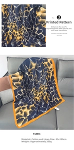 Detail of cotton linen shawl with giraffe print in navy blue and orange, 85x180cm size