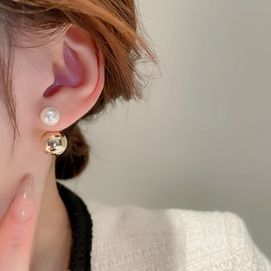 Elegant two-way faux pearl and gold metal ball double-sided stud earrings on model