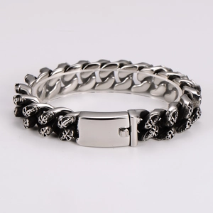 Detailed close-up of a men's punk stainless steel skull bracelet with a heavy chain