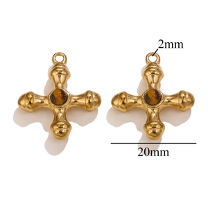 Detailed view of titanium steel cross pendants with natural tiger eye stone and 18k gold plating