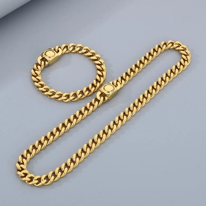 Ensemble collier et bracelet maille cubaine en acier doré avec fermoirs magnétiques
