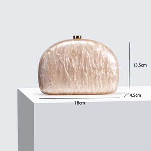 Detailed view of semicircular acrylic clutch bag with pearlescent texture and dimensions