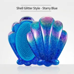 Glittery shell-shaped hairbrush in starry blue gradient finish for detangling hair