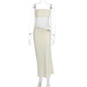 Detail of off-white dress featuring elegant lace cut-outs and slim shoulder straps