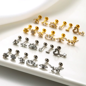 Detailed collection of G23 titanium labret studs with zircon bee and flower designs