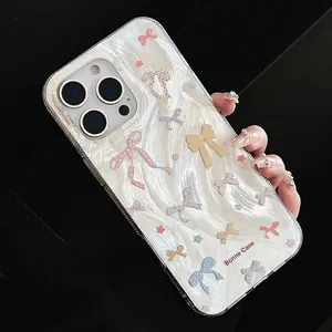 Detail of pearlescent iPhone case with wavy texture and 3D colorful bows décor