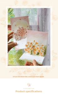Macro shot of 3D pop-up flower cards featuring laser-cut lilies and warm floral patterns