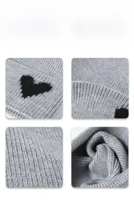 Detailed macro view of gray knitted beanie with heart pattern and ribbed texture