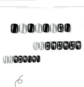 Detail view of 24pcs short square press-on nails with black and silver star patterns