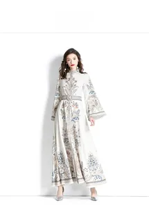 Detail of vintage floral maxi dress with flared sleeves and matching waist belt buckle