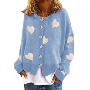 Sky blue knitted cardigan with white heart pattern and single-breasted button closure