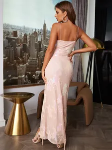 Detail of pink sequin floral embroidery and slim backless design on long evening gown