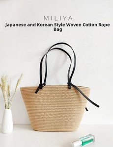 Detail of handwoven cotton rope tote bag featuring black slim straps and knotted accents