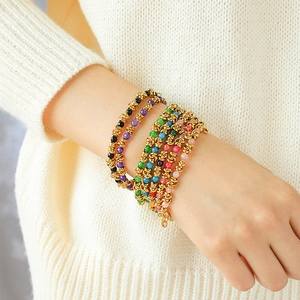 Chic gold-plated stainless steel bracelet with colorful beads shown on woman wrist