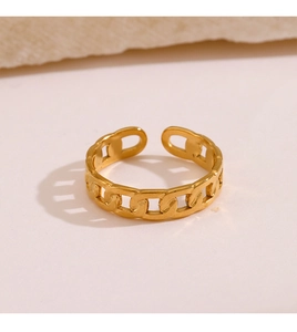 Macro shot of gold-plated stainless steel Cuban link chain ring with adjustable opening