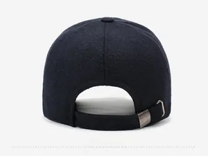 Detail view of the metal adjustment buckle and wool fabric texture on the winter baseball cap