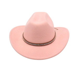 Pink western cowboy hat with studded leather band and rhinestone details on white background