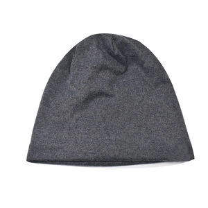Detailed knit texture of dark gray winter beanie with thermal fleece lining