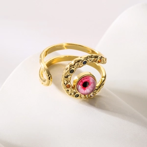 Bohemian gold evil eye open ring featuring a pink center stone and colorful crystals