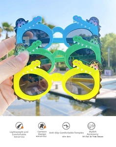 Detail of cute crocodile sunglasses for kids in blue, green and yellow colors