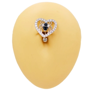 Close-up of heart-shaped belly button ring featuring a black spider and zircon inlays