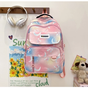 Detail of blue-pink gradient backpack with moon butterfly prints and fashion label