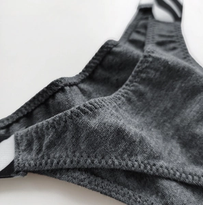 Macro view of seamless stitching and premium dark gray cotton fabric on a thong