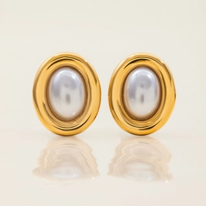 Macro shot of 18K gold-plated stainless steel square earrings with elegant oval pearls