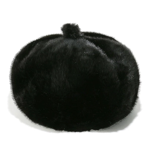 Macro view of black faux mink fur beret featuring soft texture and decorative top pompom