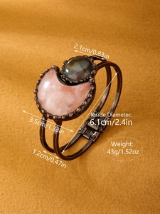 Detail view of vintage bronze cuff bracelet with size specs and rose quartz moon stone