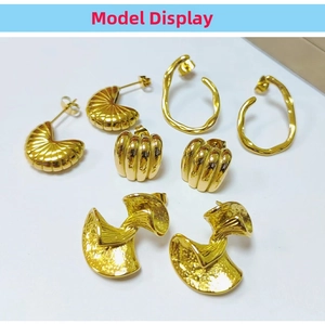 Detailed view of four pairs of 18K gold plated stainless steel earrings in various styles
