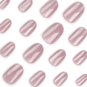 Short round cat-eye press-on nails in dusty pink with pearlescent shimmer on white backdrop
