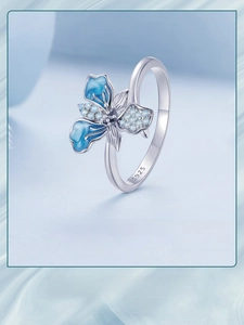 Close-up of S925 sterling silver iris flower ring with blue gradient enamel and crystals