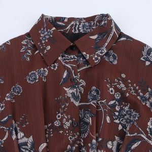 Floral chiffon dress with puff sleeves and waist tie featuring a retro botanical print